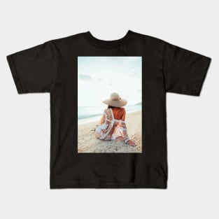 Elegant Woman Sitting on Beach and Watching the Ocean Kids T-Shirt